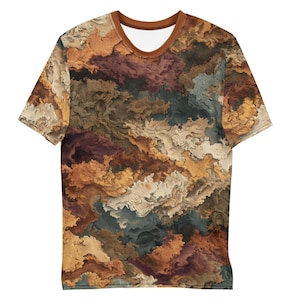 May include: Short-sleeved t-shirt with a unique abstract design. The shirt features a pattern of swirling colors, including shades of brown, orange, beige, and blue. The neckline and sleeve trim are a solid brown color.