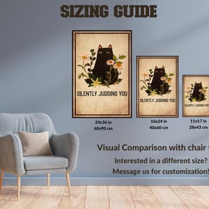 a living room with a chair and pictures on the wall