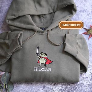 Huzzah Frog with Sword Tee, Embroidered Medieval Frog Shirt, Comfort Colors Funny DnD crewneck Renaissance Faire Frog Gift
