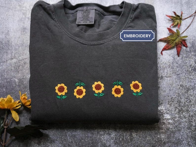 a t - shirt with embroidered sunflowers on it