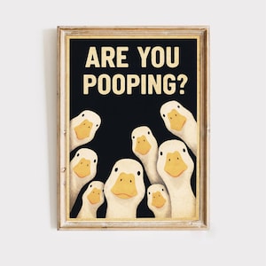 The image is a framed poster with a cartoon-style illustration of a group of ducks, with the text "ARE YOU POOPING?" displayed prominently above them.