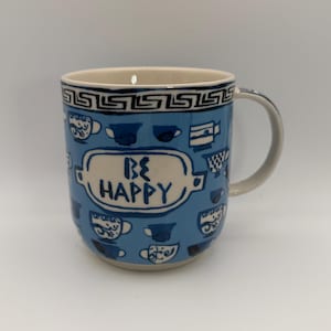 Taza de café griega ANTHROPOLOGIE Be Happy Gina de 355 ml (12 oz) - Usada imagen 1