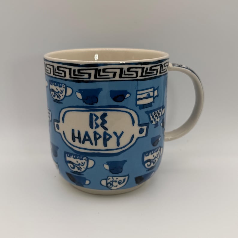 Taza de café griega ANTHROPOLOGIE Be Happy Gina de 355 ml (12 oz) - Usada imagen 1
