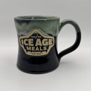 DENEEN POTTERY Paleo Nick Ice Age Meals est. 2014 Mug 12 oz. - Preowned