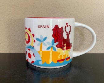 Taza de café coleccionable STARBUCKS INTERNATIONAL "You Are Here" de España, 414 ml (14 oz). - Usada.