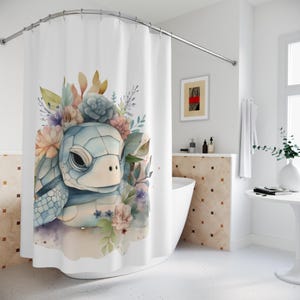 May include: A watercolor illustration of a blue turtle with a floral crown. The turtle is surrounded by pink, purple, and blue flowers. The background is white.