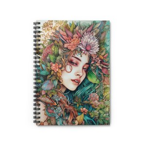 May include: A woman with blue hair is surrounded by colorful flowers and leaves. The woman has a delicate floral crown on her head and her eyes are closed. The background is a soft, light blue.