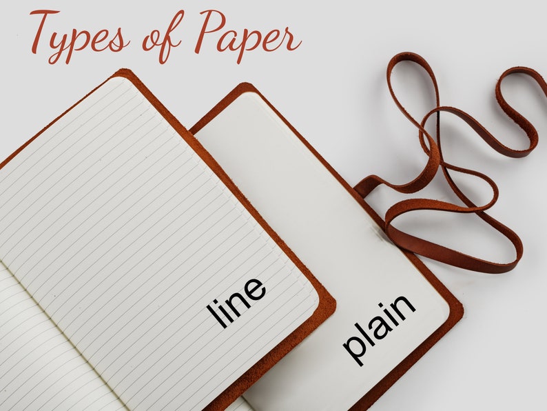 Select Types of Paper. Two open tan leather journal. On one leather journal page paper is line on the second leather journal page paper is plain.