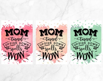 May include: Three watercolor-style prints with the text "MOM turned upside down spells WOW." Each print has a different color background: pink, peach, and green. The text is in black with a heart in the word "MOM".