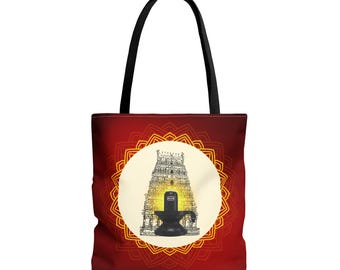 May include: Red tote bag with a mandala design and a white circle featuring a black and white illustration of a Hindu temple with a Shiva Lingam inside. The temple is illuminated with a yellow glow.