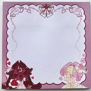 May include: Square, pink sticky note pad with a decorative border and illustrations. The border is a darker pink with a scalloped edge. The illustrations include two cartoon characters and floral accents.