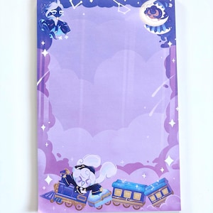 May include: A rectangular notepad with a whimsical design featuring a celestial theme. The border is decorated with stars, clouds, and a constellation pattern. The notepad has illustrations of a train and a character in a conductor's uniform, all in shades of blue and purple.