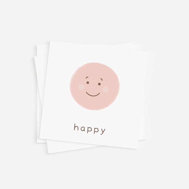 Close-up of a happy rainbow feelings flash card in pink, featuring a smiling face, perfect for teaching emotional intelligence to students.