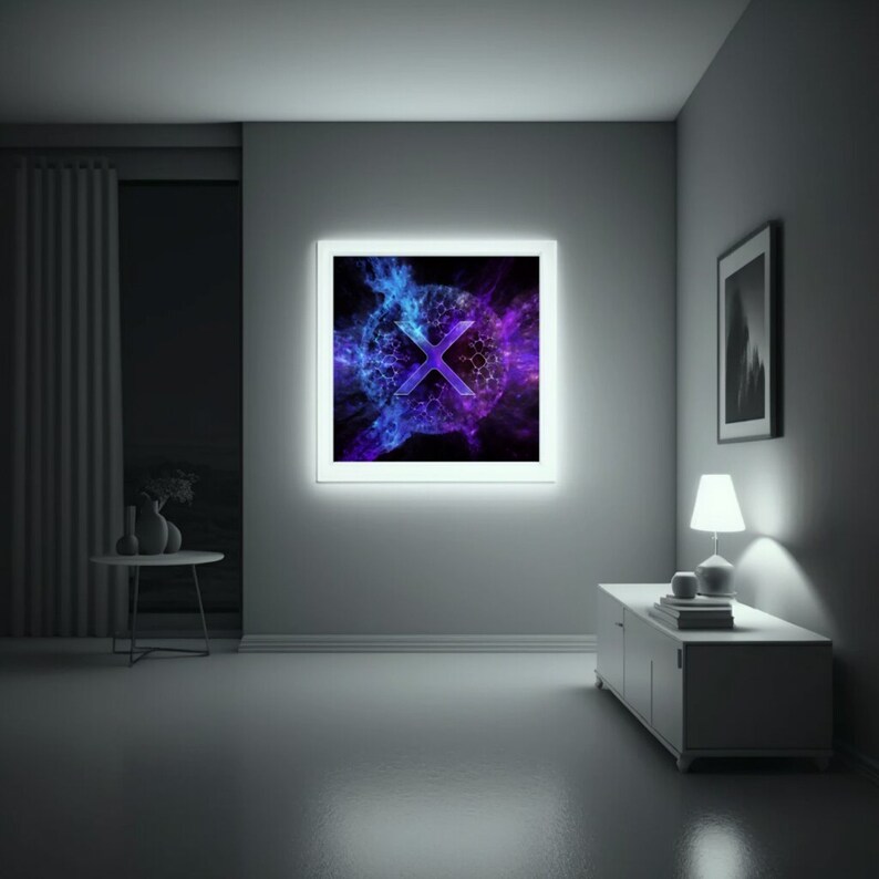 May include: A framed abstract art print with a blue and purple geometric design featuring a large white "X" in the center. The print is in a white frame and is hanging on a white wall.