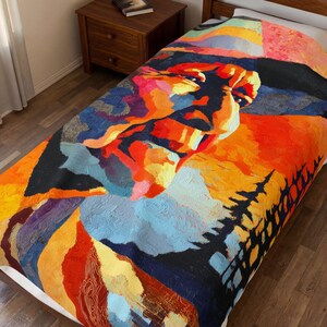 May include: A colorful blanket featuring an abstract portrait with vibrant hues of orange, red, blue, and yellow. The design includes a stylized face and a silhouette of trees, creating a unique and artistic home decor item.