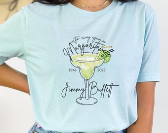 Camiseta conmemorativa de Jimmy Buffett, camiseta "Desgastándose en Margaritaville"