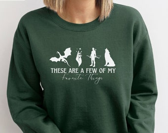 Estas son algunas de mis cosas favoritas: sudadera, suéter de lector, suéter de dragón, camiseta Romantasy Eragon