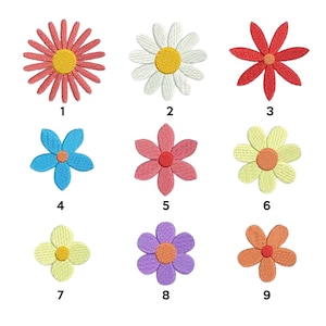 May include: Nine embroidered flower patches in various colors and styles, including pink, red, yellow, blue, and purple. The patches are numbered 1 through 9.