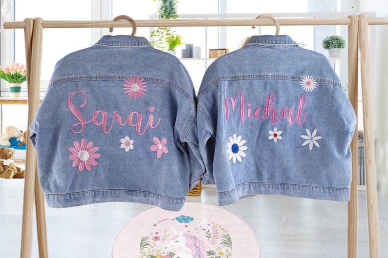 May include: Two denim jackets with embroidered flowers and names. The jacket on the left says "Sarai" and the jacket on the right says "Michael".