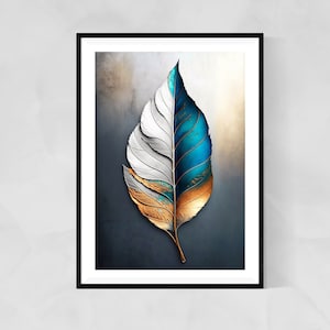 May include: Framed art print depicting a stylized leaf. The leaf is split vertically, with one side in white and gold, the other in blue and gold. The artwork has a textured look and is set against a neutral backdrop.