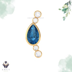 Moissanietblauwe edelsteenoorbel, gouden ring, elegante piercingsieraden