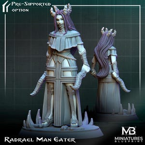 May include: A gray and white 3D printed miniature of a female figure with horns and long hair. The figure is wearing a long robe with a cross pattern. The miniature is posed with one hand raised and the other holding a curved object. The miniature is standing on a base with a text label that reads "Radrael Man Eater".