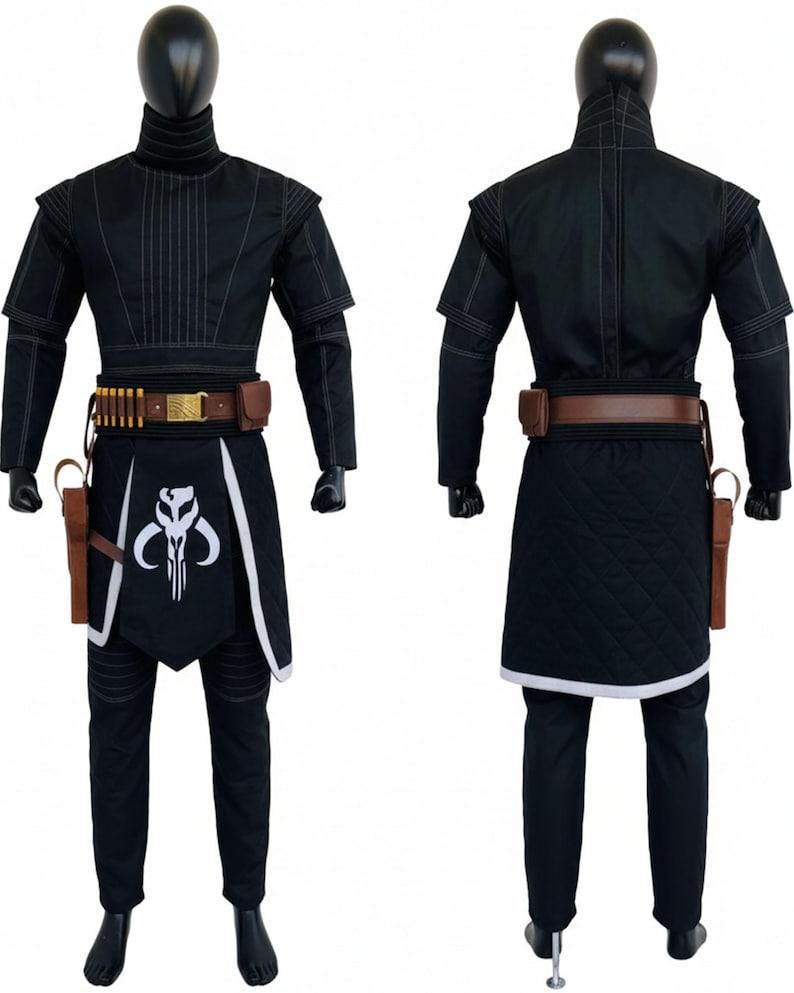 May include: A black costume set featuring a high-neck tunic with white stitching, matching trousers, and a quilted apron with a white Mythosaur skull emblem. Includes a brown utility belt with gold accents, ammunition loops, and a side holster.