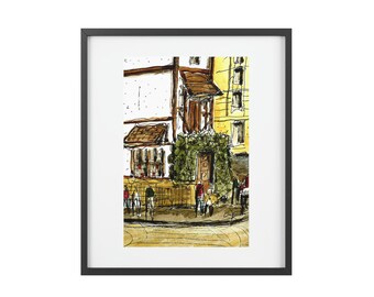 May include: Watercolor painting of a European street scene in a black frame. The artwork depicts buildings with brown awnings, a green-covered doorway, and figures on bicycles and walking on the sidewalk. The color palette includes browns, yellows, and greens.