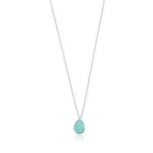 May include: A silver chain necklace with a teardrop-shaped pendant featuring a light blue gemstone.
