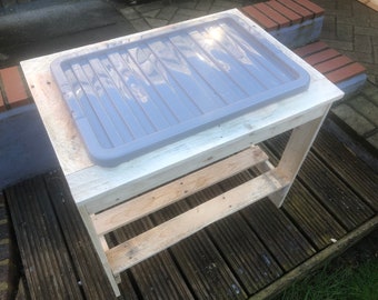 Water/Sand tray with plastic containers included and storage shelf. Various sizes and combinations available. Recycled pallet wood.