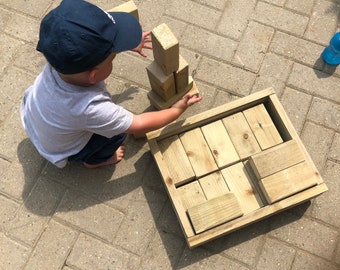 Play Bricks for outdoor or indoor use in wooden crate with wheels.
