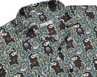 May include: Button-up shirt with a teal background and a repeating pattern of plague doctor figures, rats, stars, and other small illustrations. The shirt has a collar and black buttons. The text "becca alessi" is visible on the shirt.