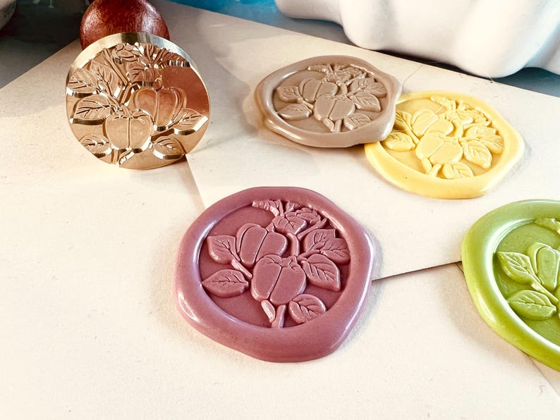 Peach wax seal stamp, Fruit-themed wax seal, Elegant botanical wax seal, Handmade fruit wax stamp, Custom peach wax seal, Engraved fruit wax stamp, Vintage orchard wax seal, Nature-inspired wax stamp, Cottagecore fruit wax seal, Summer harvest wax seal, Botanical peach wax stamp, Whimsical fruit wax seal, Rustic peach wax seal, Garden-inspired wax stamp, Sweet peach stationery wax seal, Floral and fruit wax stamp, Personalized botanical wax seal, Farmhouse peach wax stamp