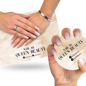 May include: Two hands showcasing long, square-shaped nails with a white to pink ombre design. The nails are featured on a rectangular card and a circular card, both with the text "NAIL BY QUEEN BEAUTY".