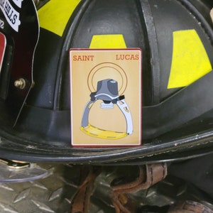 Saint Lucas Firefighter aluminum helmet cards.  Heavy duty band and Magnet options available.
