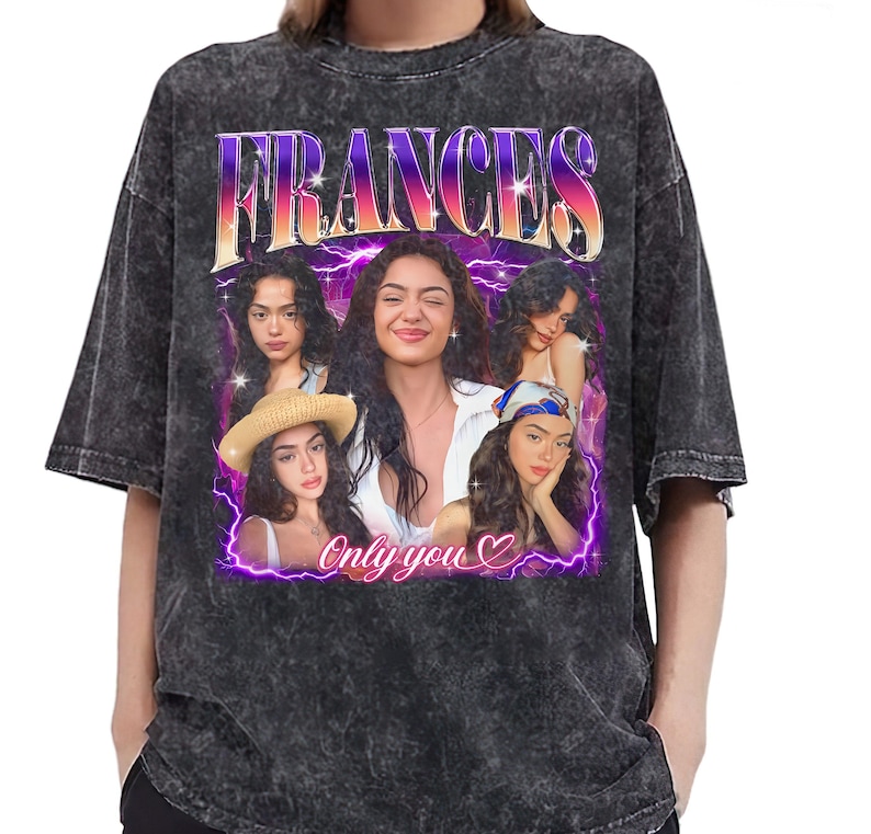 May include: Dark gray acid wash t-shirt featuring a graphic of a woman with the name "FRANCES" in a purple and orange gradient. The graphic includes multiple images of the woman and the text "Only you" with a heart symbol.