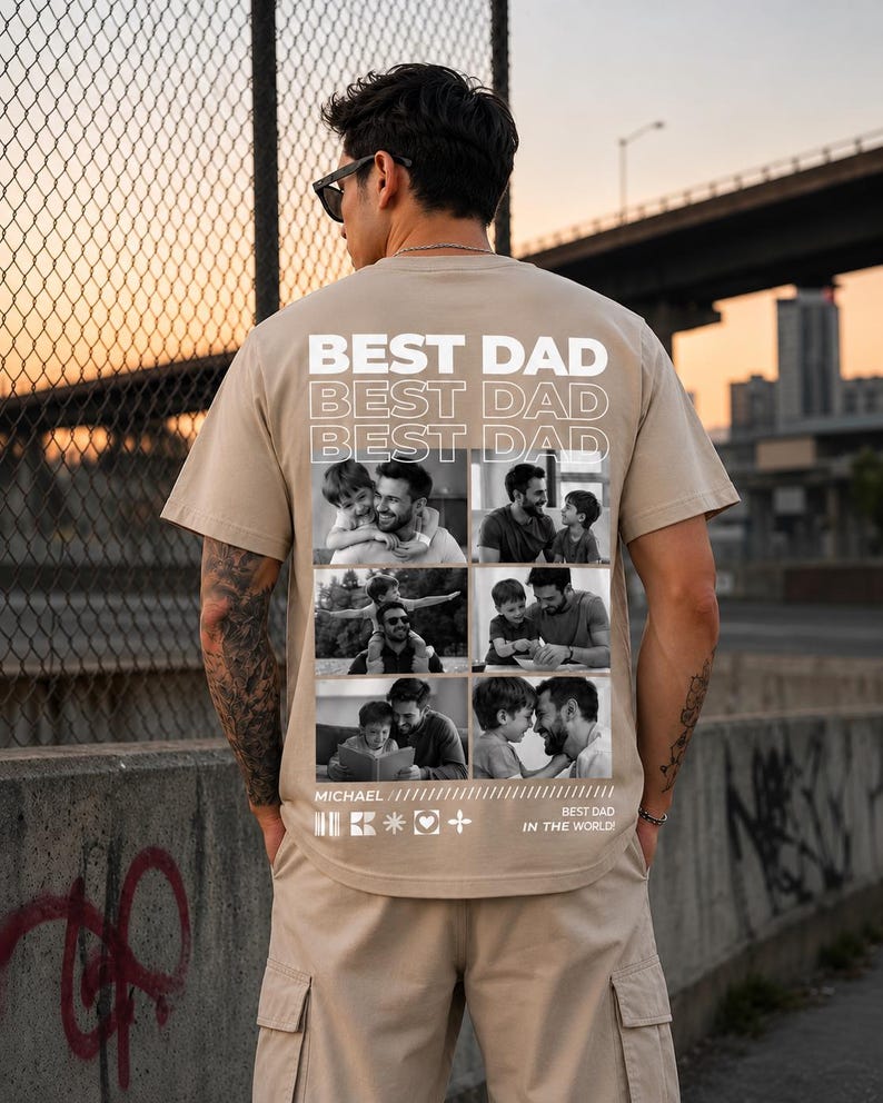 Puede incluir: Una camiseta color beige con la frase "BEST DAD" repetida tres veces en letras blancas. Debajo, nueve fotos en blanco y negro de un padre y un hijo. Tambi&eacute;n se ve el texto "MICHAEL" y "BEST DAD IN THE WORLD!"