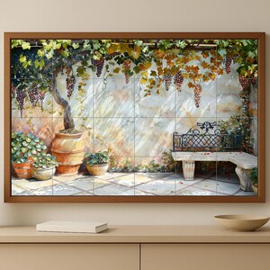 May include: A framed artwork showing a Tuscan scene with a grape vine, pots of plants, and a stone bench. The artwork uses a warm colour palette with shades of brown, green, and purple. The image is framed in dark wood.