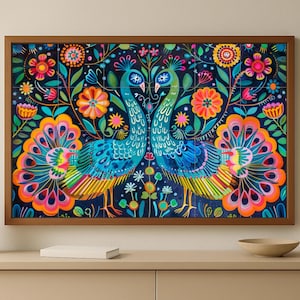 May include: A framed artwork featuring two stylized peacocks with vibrant blue, green, yellow, and orange plumage. The birds are set against a dark blue background with colorful floral and foliage elements. The artwork is in a brown wooden frame.