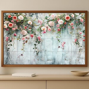 May include: A framed floral print featuring a wooden frame. The artwork showcases a weathered, light blue background with a grid pattern, adorned with cascading roses in shades of pink and white, and green vines.