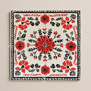 May include: A set of four square tiles with a floral design in red and black on an off-white background. The tiles combine to form a larger square, with a black border and a central floral motif. Each tile measures approximately 30 cm x 30 cm.