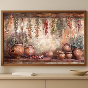 May include: A framed artwork depicting a rustic kitchen scene. It features terracotta pots with herbs, hanging produce like garlic and peppers, and a warm color palette. The artwork is displayed on a neutral-toned wall.