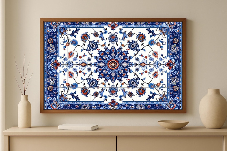 May include: A framed wall art print featuring a detailed floral pattern in shades of blue, red, and white. The design is centered on a white background and framed with a brown wooden border. The artwork is displayed on a light-colored cabinet.