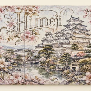 May include: A rectangular wall art piece featuring a detailed illustration of Himeji Castle surrounded by blooming pink cherry blossom branches. The scene includes a stone lantern, a small wooden bridge over a pond, and the word Himeji in script.