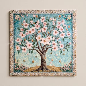 Puede incluir: Obra de arte mural cuadrada que representa un árbol floreciente con flores rosas, sobre un fondo azul claro. El tronco del árbol es marrón, con abejas y almendras cayendo. El borde tiene un diseño floral decorativo.