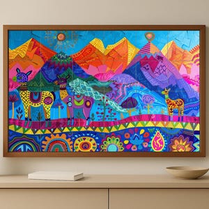 May include: A framed, colorful folk art print featuring stylized llamas and mountains. The artwork uses a vibrant palette of blues, oranges, pinks, and yellows. The print is displayed on a light-colored surface with decorative items.