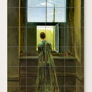 May include: A woman in a green dress stands before an open window, gazing out at a bright sky and a distant structure. The interior features dark wood paneling and a simple window frame. Two small bottles sit on the windowsill.