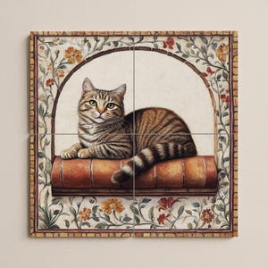May include: A tabby cat lies on a brick ledge within an arched frame. The cat has brown and black stripes. The frame is decorated with floral patterns in orange, red, and green. The artwork is a square format.