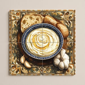 May include: A still-life image of a bowl of creamy dip with a swirl of olive oil, surrounded by bread, garlic cloves, and a whole garlic bulb. The bowl has a blue rim with a white and blue pattern. The food is arranged on a wooden board.