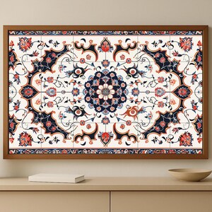 May include: A framed wall art piece featuring a detailed floral pattern. The design incorporates a central medallion and repeating motifs in navy, red, and blue on a white background. The frame is a warm brown.